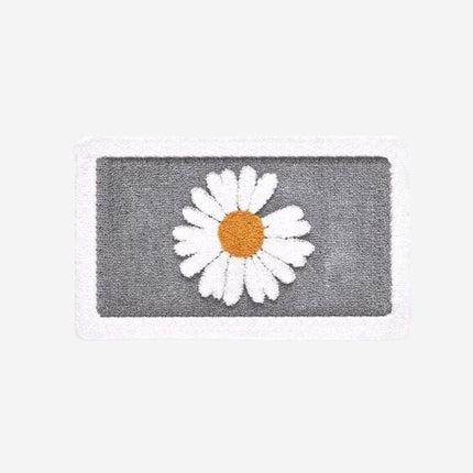 Absorberende dørmatte med tusenfrydmotiv