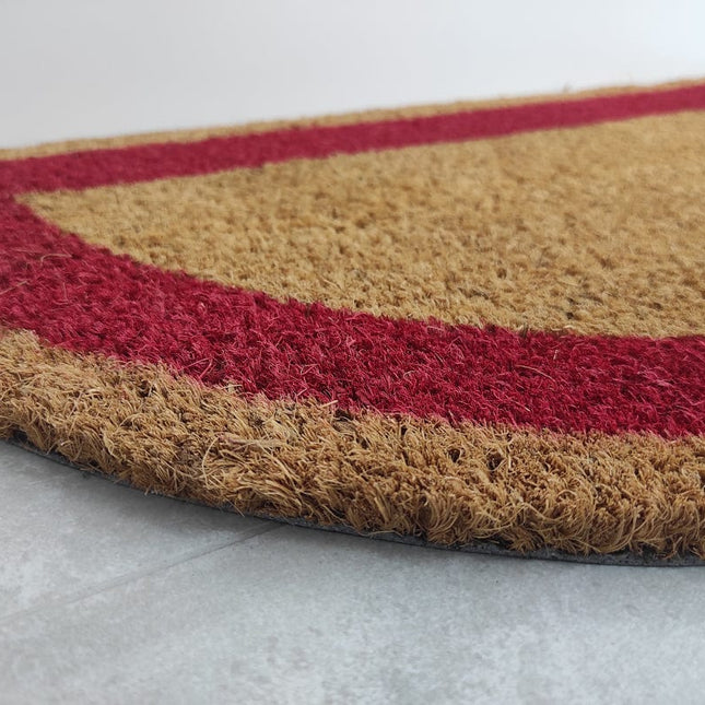 Halvmåneformet dørmatte i kokosfiber