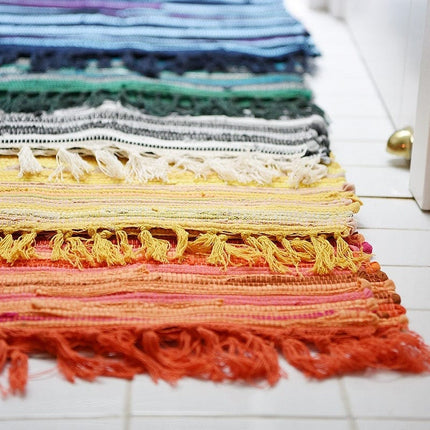 Fargerik fillerye dørmatte med frynser