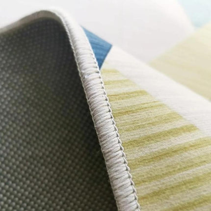 Geometrisk gulvteppe i blått og grått