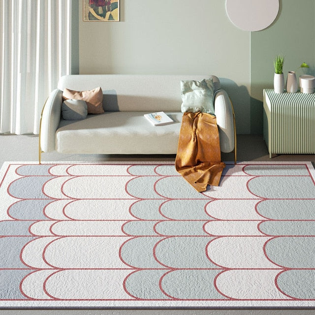 Blått og hvitt teppe med buemønster