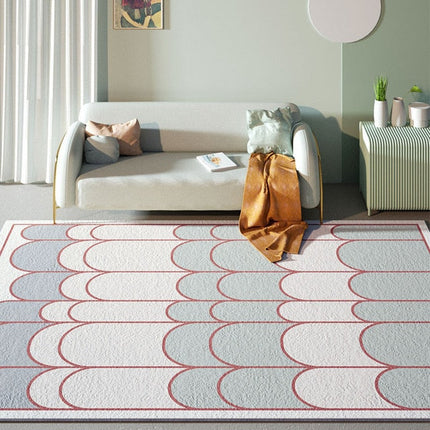 Blått og hvitt teppe med buemønster