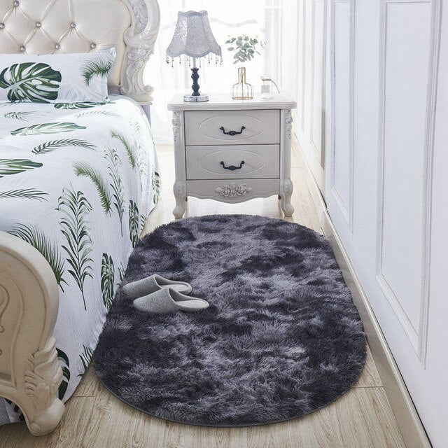 Myk oval sengeforlegger i mørkegrått