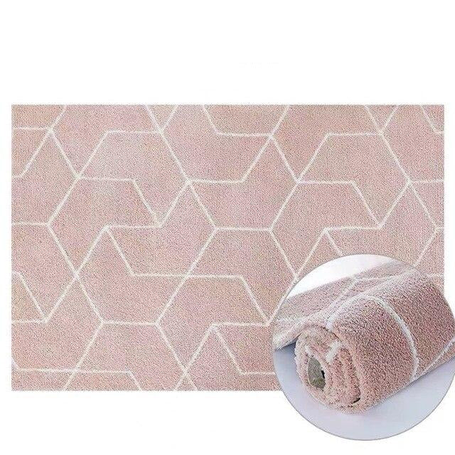 Puderrosa shaggy-teppe med geometrisk mønster