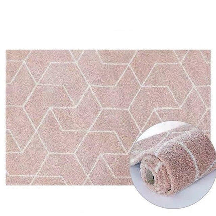 Puderrosa shaggy-teppe med geometrisk mønster