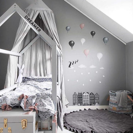 Rundt grått teppe for barnerom