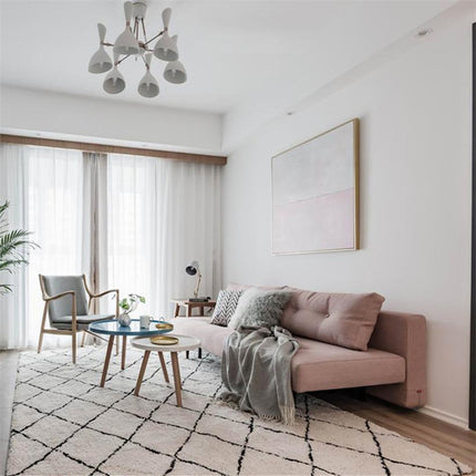 Hvitt berberteppe med svart diamantmønster