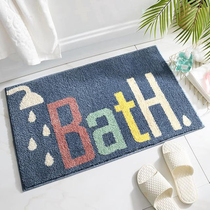 Kongeblå badematte med "Bath" tekst