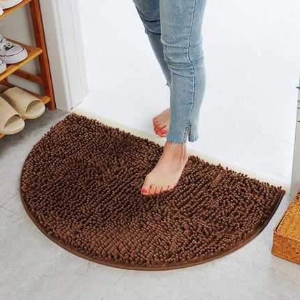 Brun halvmåneformet badematte