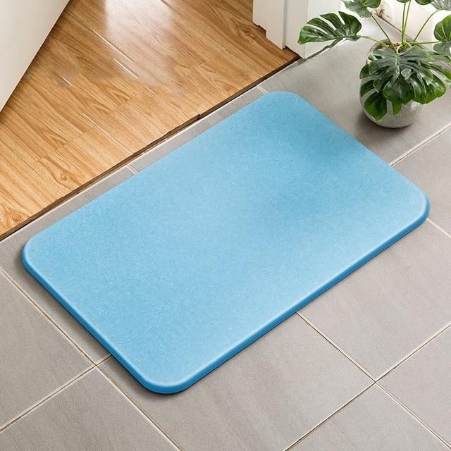 Absorberende badematte av diatomitt stein