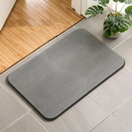 Absorberende badematte av diatomitt stein