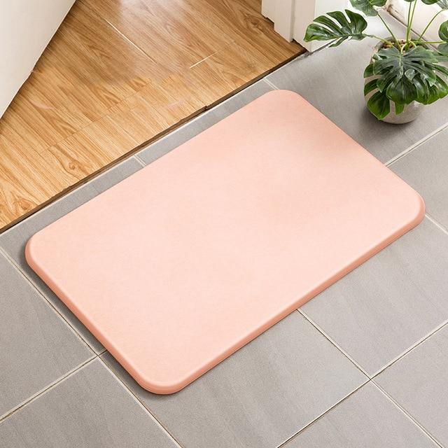 Absorberende badematte av diatomitt stein