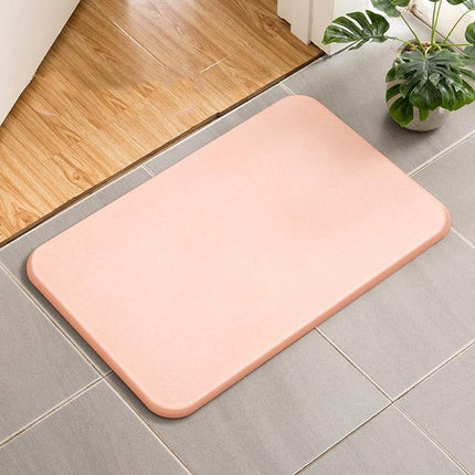 Absorberende badematte av diatomitt stein