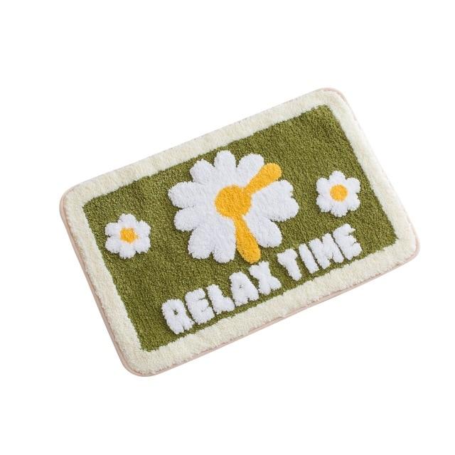 Grønn badematte med blomster, gress-effekt