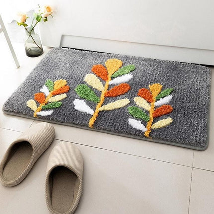 Grå badematte med broderte blomster
