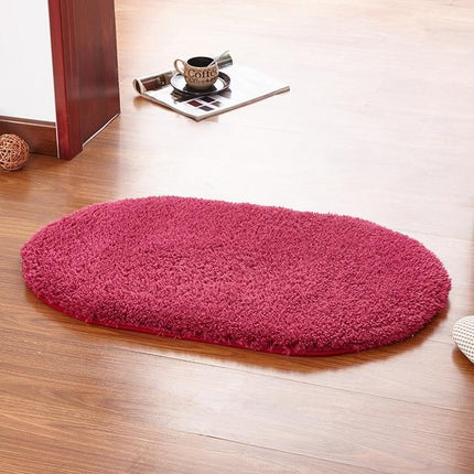 Oval shaggy badematte i fuchsia