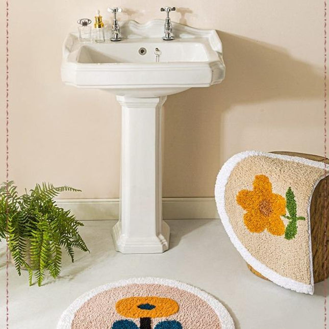 Halvrund badematte med gul blomst