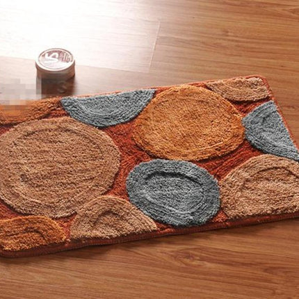 Brun badematte med runde steiner