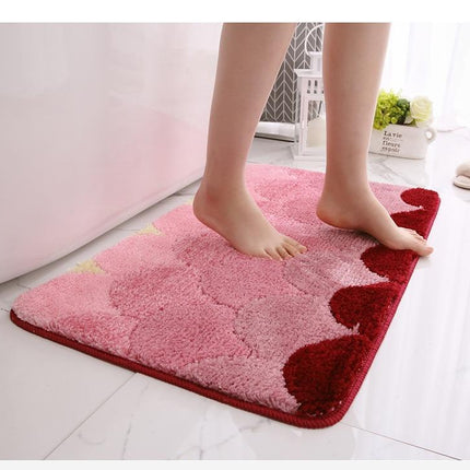 Myk badematte i rødt og rosa