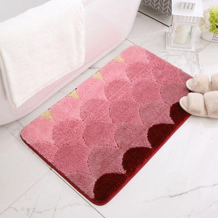 Myk badematte i rødt og rosa