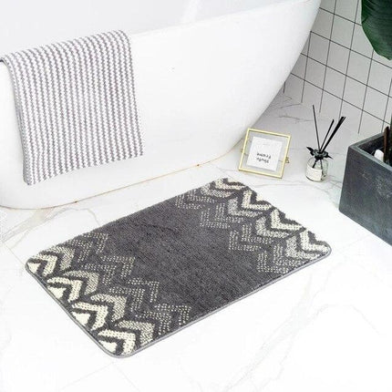 Grå baderomsmatte med geometrisk design