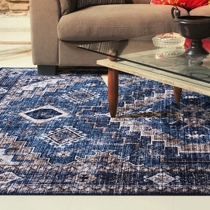 Blått vintage teppe med geometrisk mønster
